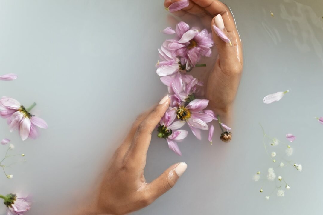 woman holding flowers in hands in water